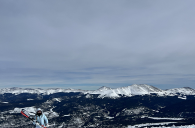 a person holding skis on a snowy mountain