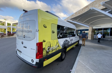 a white and yellow van parked outside a building