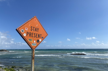 a sign on a beach