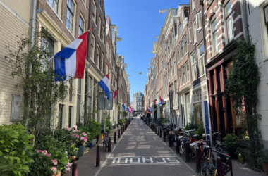 a street with flags and bicycles