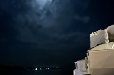 a moon over a body of water