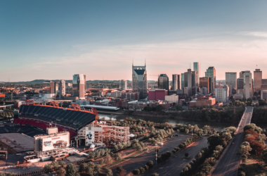 a city with a river and a stadium