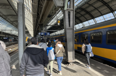 people standing in a train station