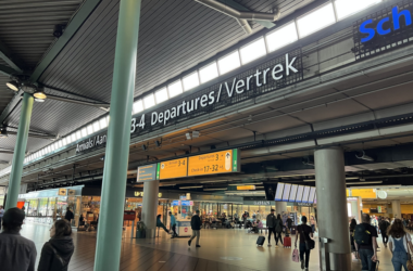 a group of people walking in a terminal