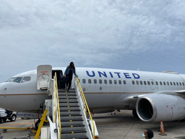 a woman standing on a plane