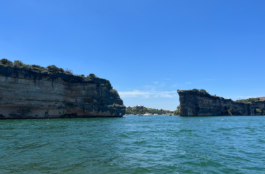 a large rock formation in the water