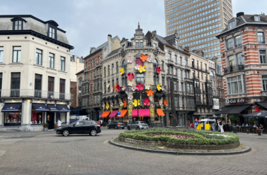 a building with flowers on the side