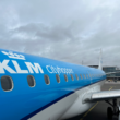 a blue and white airplane with white text on it