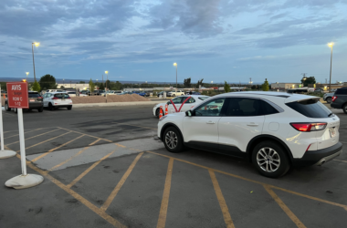 a group of cars parked in a parking lot