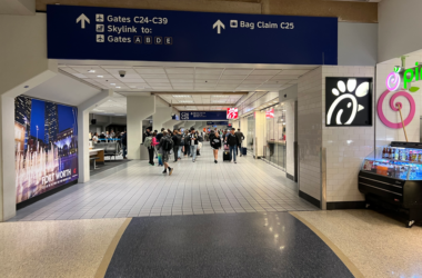 a group of people walking in a building