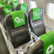 a row of seats with green banners on them