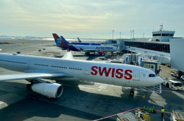 a group of airplanes at an airport