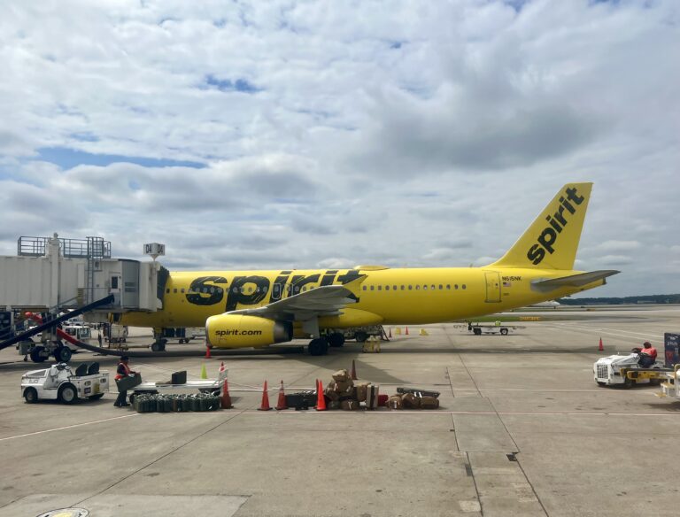 a yellow airplane on a tarmac
