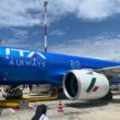 a blue airplane with white text on it