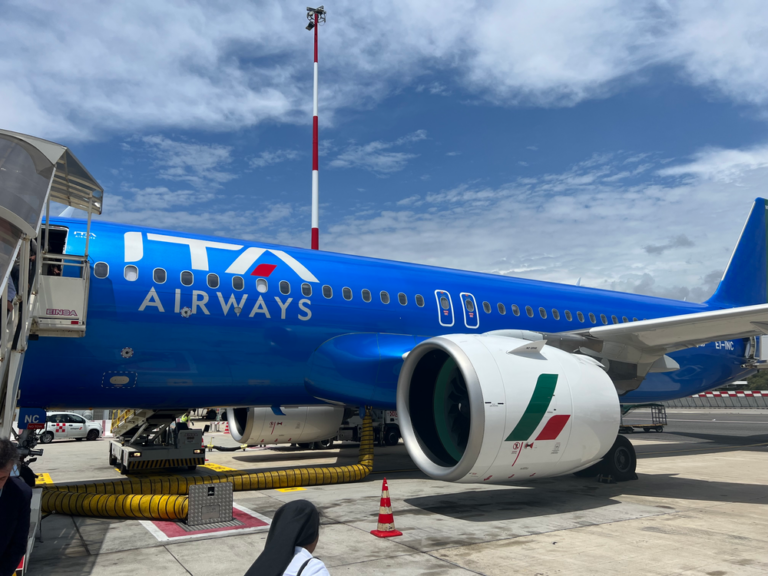 a blue airplane with white text on it