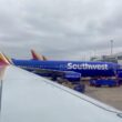 a blue airplane parked at an airport