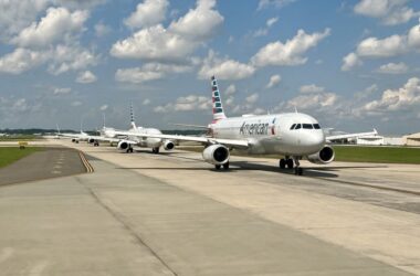 a group of airplanes on a runway