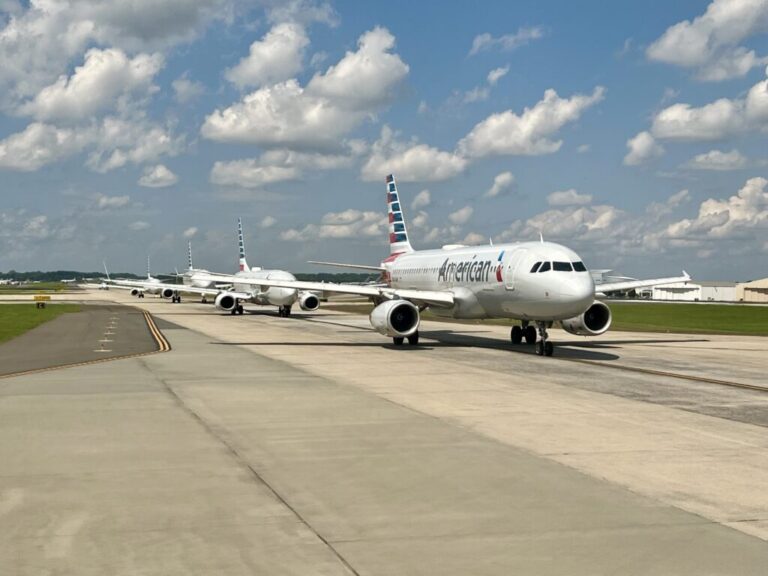 a group of airplanes on a runway