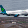 a plane flying over a body of water