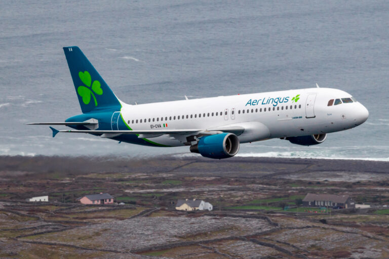 a plane flying over a body of water