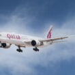 a white airplane flying in the sky