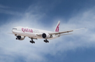 a white airplane flying in the sky