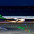 a plane on the runway at night