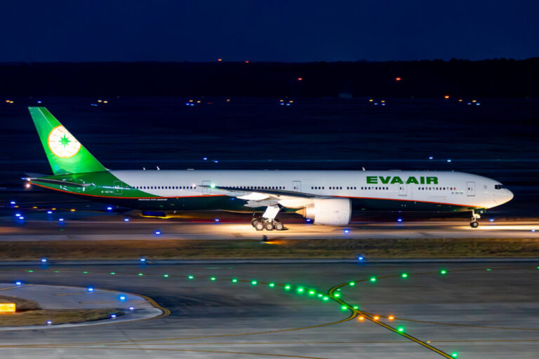 a plane on the runway at night