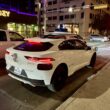 a white car parked on a street