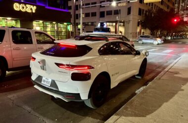 a white car parked on a street