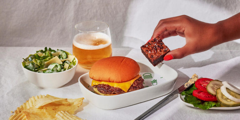 Delta Air Lines is partnering with Shake Shack to provide cheeseburgers as a pre-order option for passengers traveling in First Class.