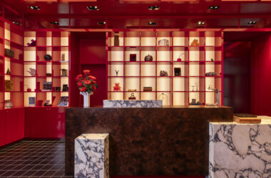 a counter in a room with red and white shelves