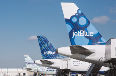 a group of airplanes parked in a row