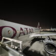 a plane on the runway at night
