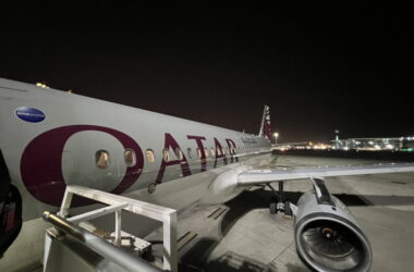a plane on the runway at night