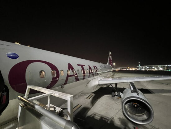 a plane on the runway at night