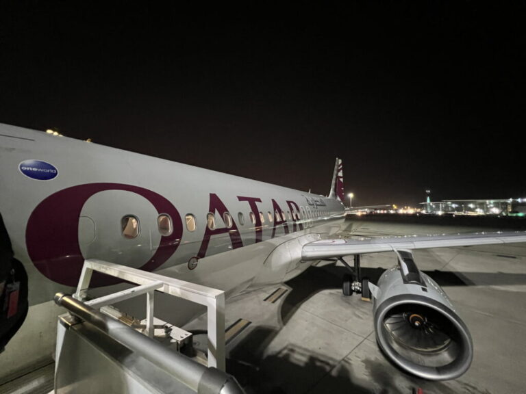 a plane on the runway at night