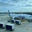 a group of airplanes at an airport