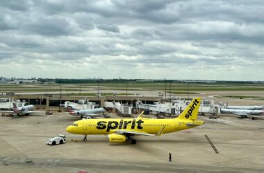 a yellow airplane on a runway