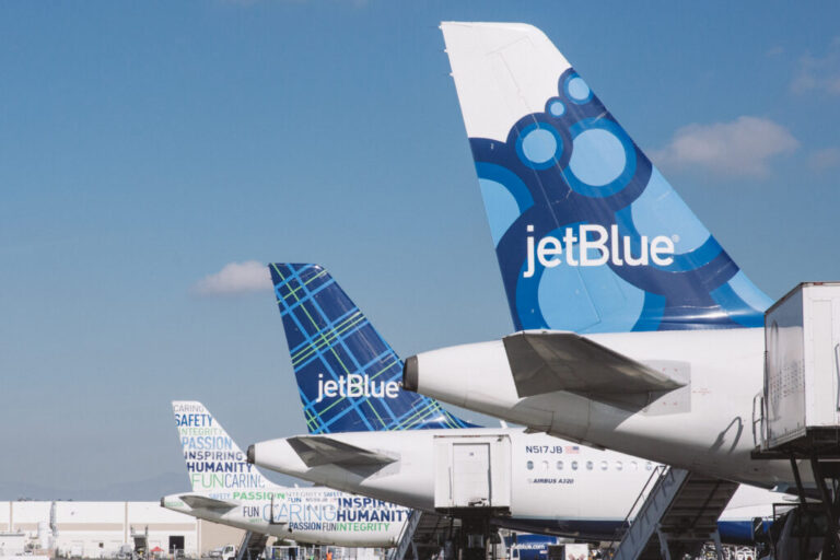 a group of airplanes parked in a row