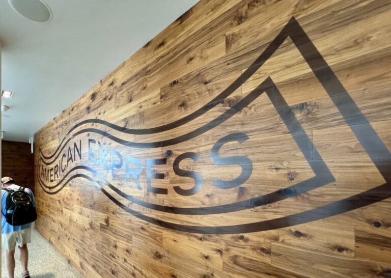 a wood wall with a logo