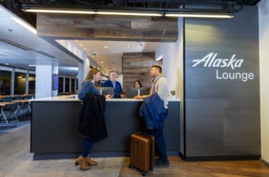 a group of people standing at a reception desk