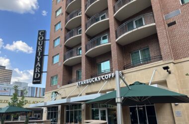 a building with many balconies and a sign