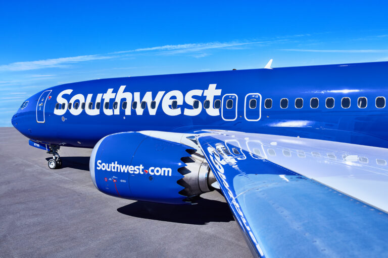 a blue airplane with white text on it