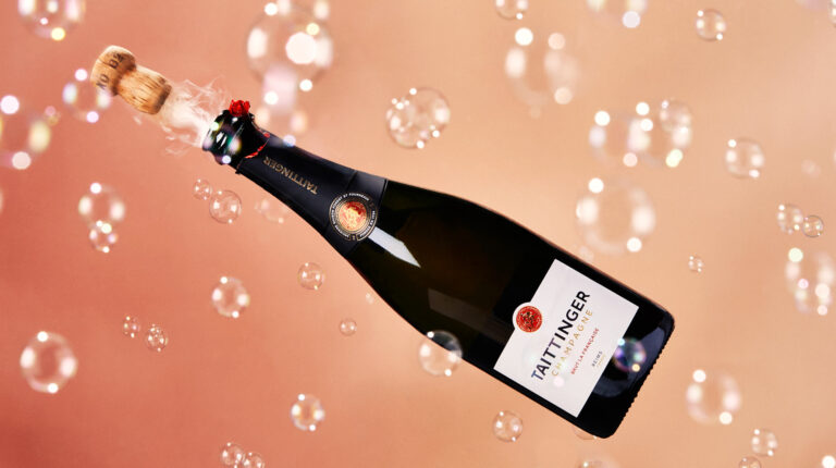 a bottle of champagne with bubbles