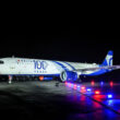 a plane on the runway at night