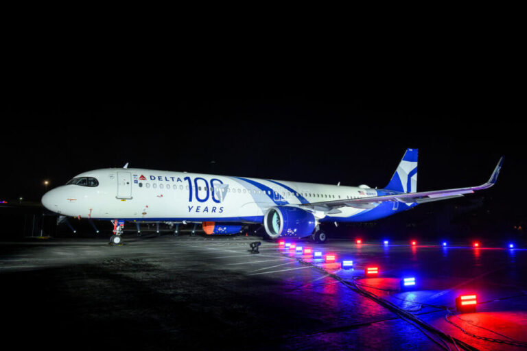 a plane on the runway at night