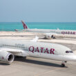 a group of airplanes on a runway