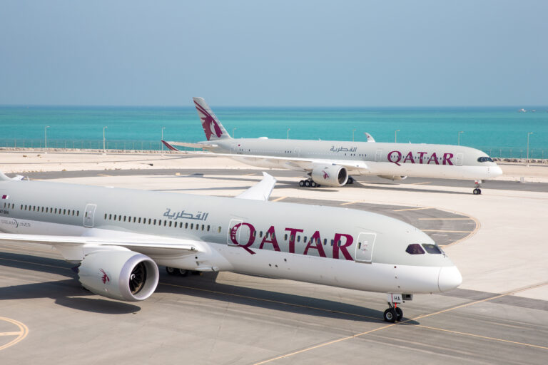 a group of airplanes on a runway