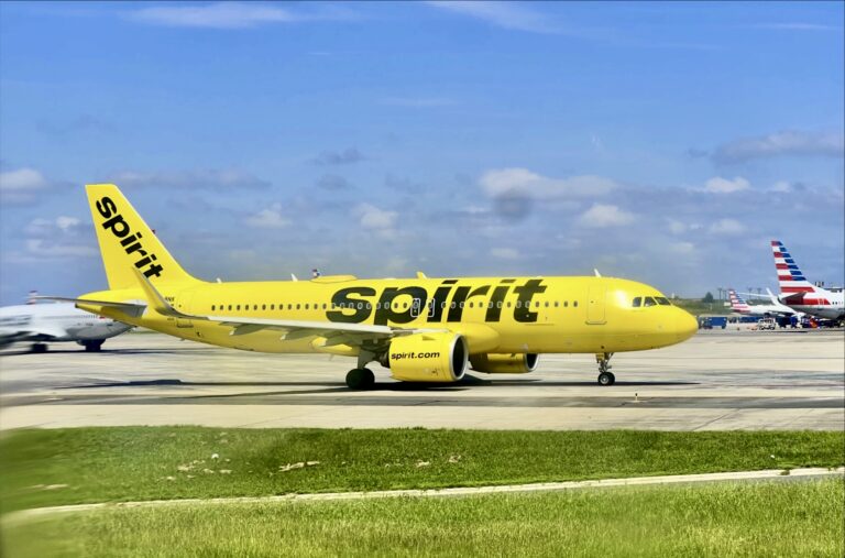 a yellow airplane on a runway